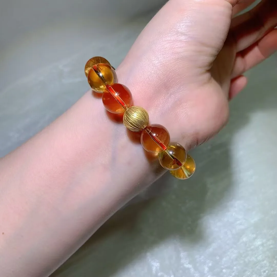 红绳串起的天然巴西黄水晶手链,大颗通透的金黄到橙色圆珠